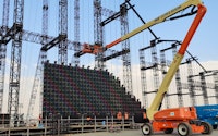 Crane installing a massive structure for an event managed by SWH