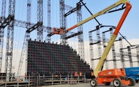 Crane installing a massive structure for an event managed by SWH