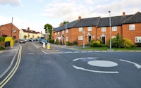 Roundabout on a road in a typical british town 258600227
