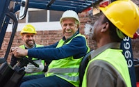 Group of logistics team has fun and laughing together as loading a delivery